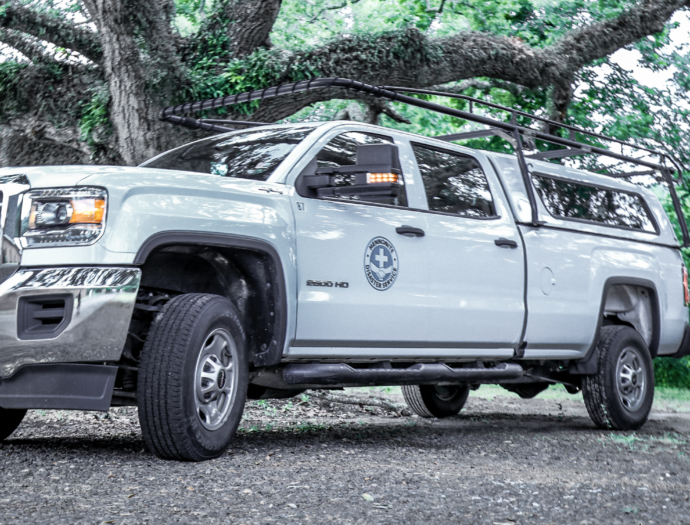 An MDS truck sits under a majestic tree at the Jennings, LA base camp.